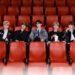 ZEROBASEONE sitting in a movie theater, comeback poster for "CINEMA PARADISE"